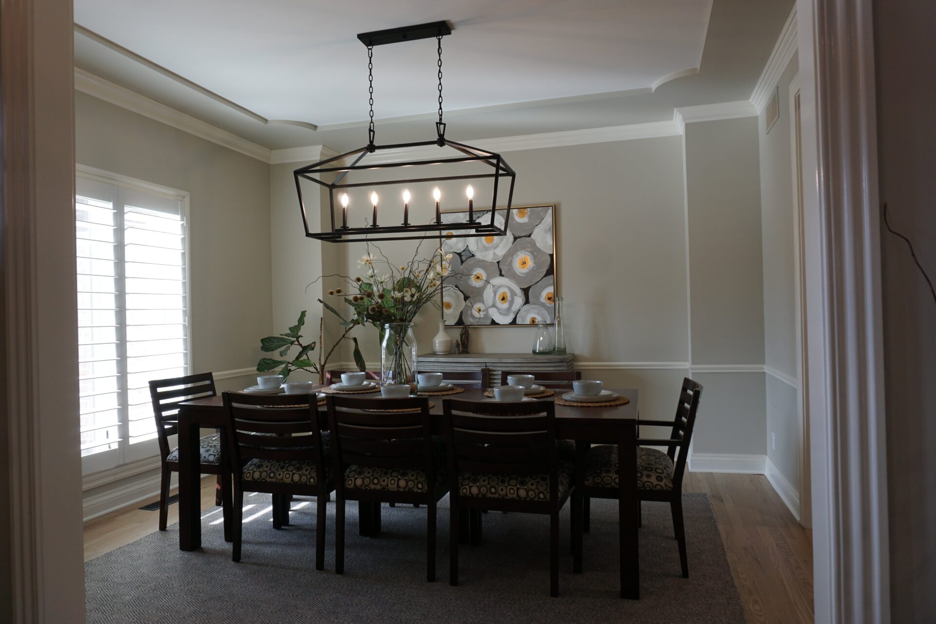 white dining room with black table