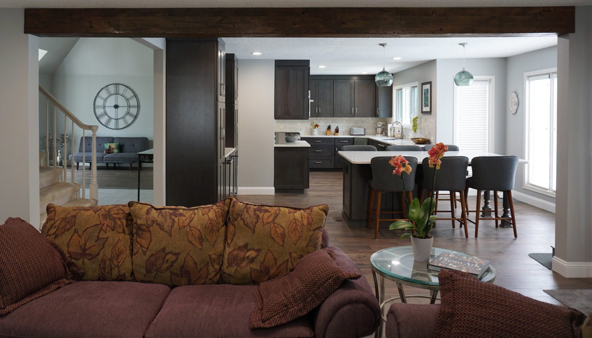 connected living room and kitchen with stairs